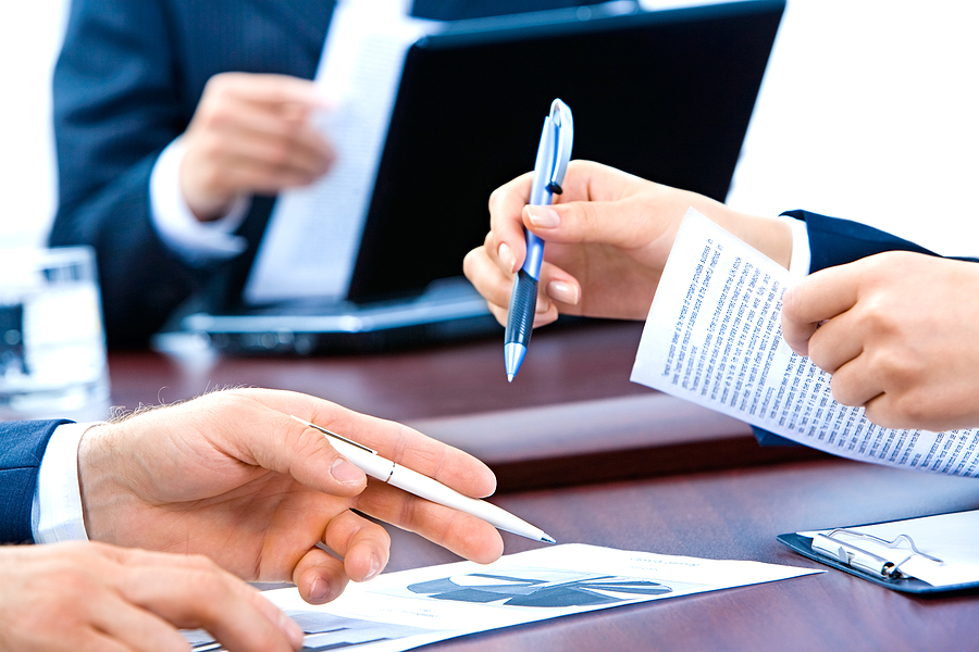 A prospective buyer scrutinizing a company's details, considering both tangible and intangible aspects of a potential business purchase.